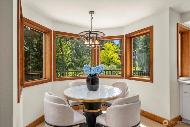 13710 41st Ave NE, Seattle, WA 98125 - dining space with a chandelier and baseboards