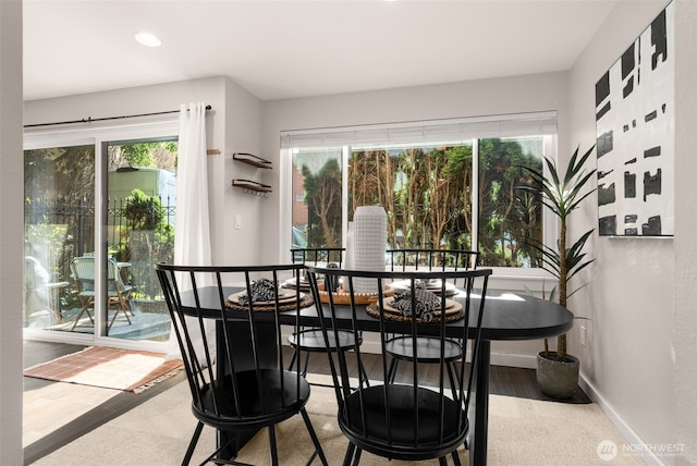 2219 Eastlake Ave E Unit 101, Seattle, WA 98102 - dining space with healthy amount of natural light, wood finished floors, and recessed lighting