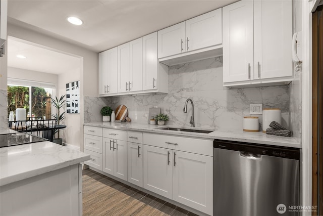 2219 Eastlake Ave E Unit 101, Seattle, WA 98102 - kitchen with stainless steel dishwasher, white cabinetry, decorative backsplash, light stone countertops, and recessed lighting