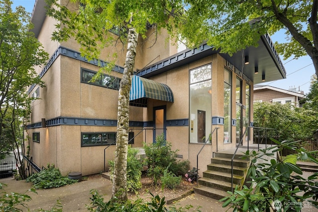 2219 Eastlake Ave E Unit 101, Seattle, WA 98102 - rear view of property featuring stucco siding