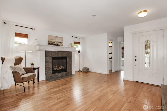 1344 Foreman Rd, Dupont, WA 98327 - living area with light wood finished floors and a tile fireplace