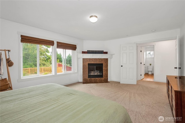 1344 Foreman Rd, Dupont, WA 98327 - bedroom with light colored carpet and a tile fireplace