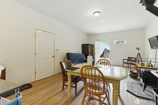 442 Rhododendron Dr, Sequim, WA 98382 - dining area featuring light wood-style floors and a wood stove