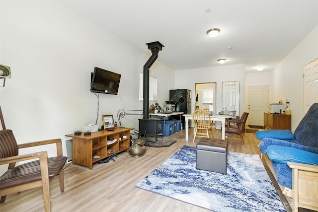 442 Rhododendron Dr, Sequim, WA 98382 - living room featuring a wood stove and light wood-style floors