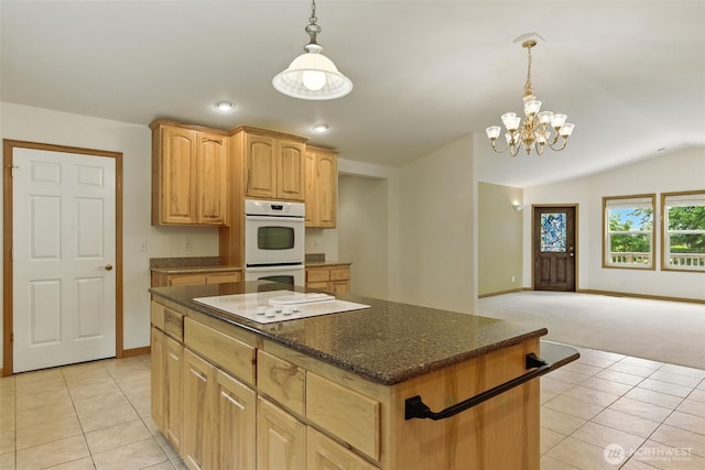 442 Rhododendron Dr, Sequim, WA 98382 - kitchen with white appliances, light tile patterned floors, a chandelier, a center island, and hanging light fixtures