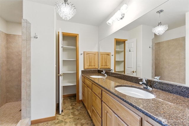 442 Rhododendron Dr, Sequim, WA 98382 - bathroom featuring a chandelier, double vanity, walk in shower, and a closet