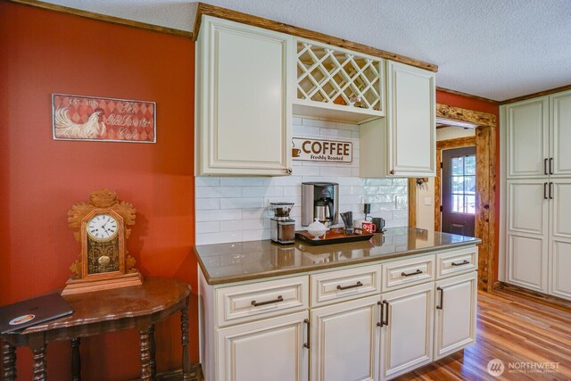 19910 NE 356th St, Yacolt, WA 98675 - kitchen with tasteful backsplash, wood finished floors, a textured ceiling, and white cabinetry