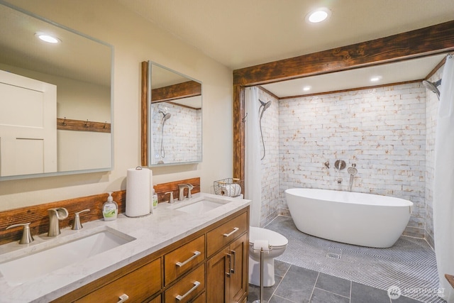 19910 NE 356th St, Yacolt, WA 98675 - full bathroom featuring a freestanding bath, double vanity, tile patterned floors, and recessed lighting