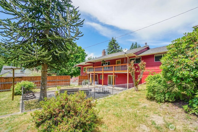 19910 NE 356th St, Yacolt, WA 98675 - back of property featuring a patio area, a chimney, and a wooden deck