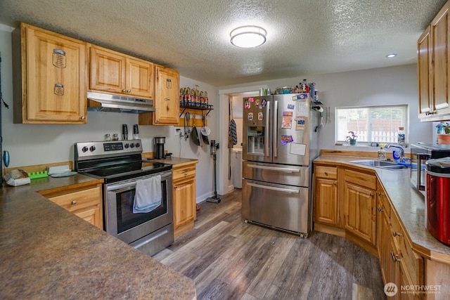 19910 NE 356th St, Yacolt, WA 98675 - kitchen with stainless steel appliances, under cabinet range hood, a textured ceiling, and wood finished floors