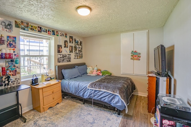 19910 NE 356th St, Yacolt, WA 98675 - bedroom featuring a textured ceiling and wood finished floors