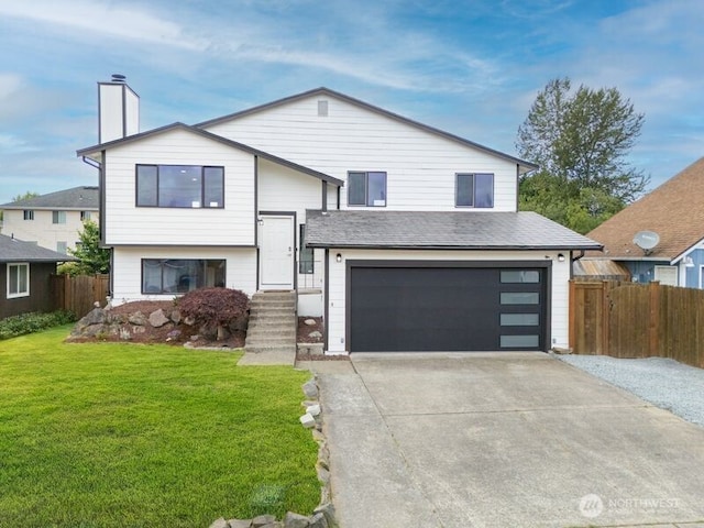 2316 67th Ave NE, Tacoma, WA 98422 - view of front facade featuring a garage, concrete driveway, and a chimney