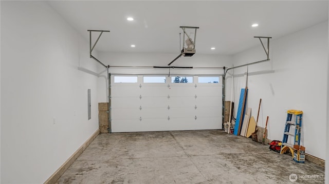 1225 S 234th Dr, Des Moines, WA 98198 - garage featuring a garage door opener, recessed lighting, and electric panel