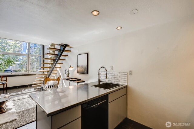 1000 Union St Unit 215, Seattle, WA 98101 - kitchen with black dishwasher, a peninsula, decorative backsplash, and recessed lighting