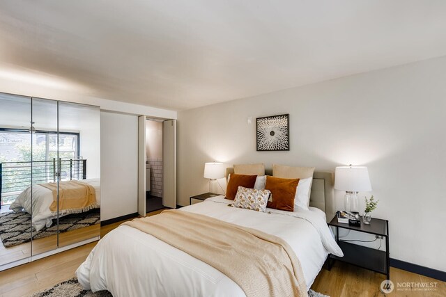 1000 Union St Unit 215, Seattle, WA 98101 - bedroom with wood finished floors