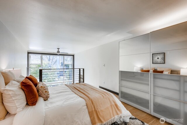 1000 Union St Unit 215, Seattle, WA 98101 - bedroom with light wood-type flooring and ceiling fan