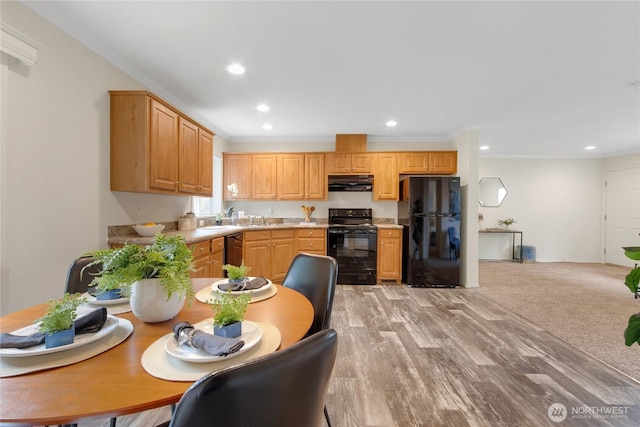 15807 78th Avenue Ct E, Puyallup, WA 98375 - kitchen with black appliances, under cabinet range hood, ornamental molding, light countertops, and recessed lighting