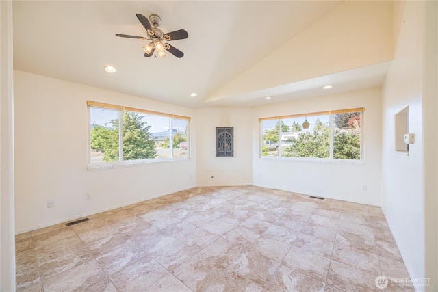 702 E Alder, Sequim, WA 98382 - unfurnished room featuring plenty of natural light, vaulted ceiling, recessed lighting, ceiling fan, and stone finish flooring