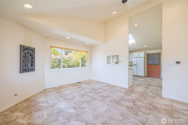 702 E Alder, Sequim, WA 98382 - unfurnished room featuring a skylight, recessed lighting, and high vaulted ceiling