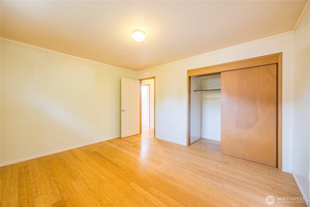 702 E Alder, Sequim, WA 98382 - unfurnished bedroom featuring light wood finished floors, a closet, and ornamental molding