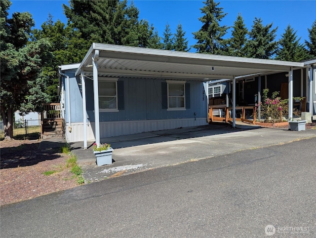 30925 114th Ln SE, Auburn, WA 98092 - manufactured / mobile home featuring an attached carport