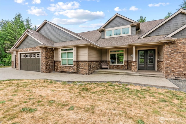 140 Bowers, Chehalis, WA 98532 - craftsman inspired home with french doors, concrete driveway, an attached garage, a front lawn, and stone siding