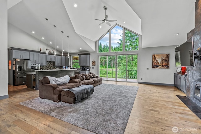 140 Bowers, Chehalis, WA 98532 - living room featuring high vaulted ceiling, a ceiling fan, light wood-type flooring, and recessed lighting