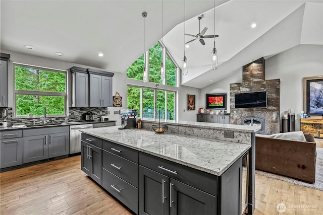 140 Bowers, Chehalis, WA 98532 - kitchen with stainless steel dishwasher, open floor plan, ceiling fan, a kitchen island, and recessed lighting