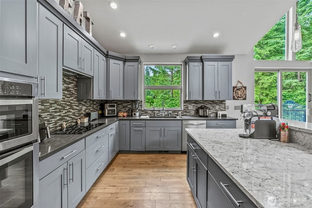 140 Bowers, Chehalis, WA 98532 - kitchen featuring stainless steel appliances, plenty of natural light, light wood finished floors, backsplash, and recessed lighting