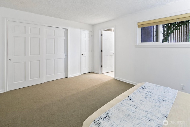 4444 44th Ave SW Unit 101, Seattle, WA 98116 - bedroom featuring carpet floors and a textured ceiling