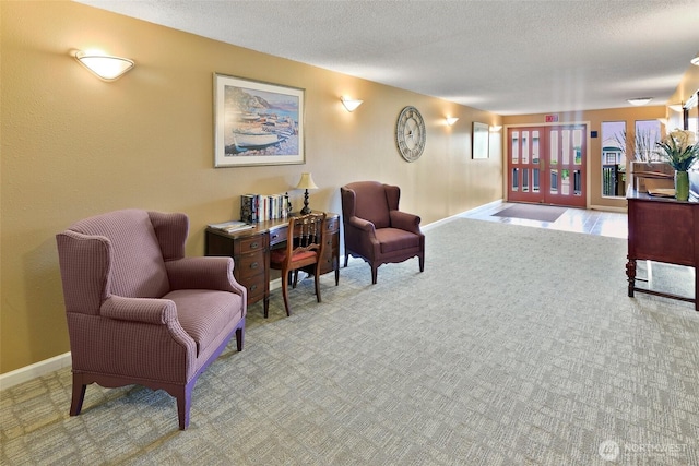 4444 44th Ave SW Unit 101, Seattle, WA 98116 - sitting room featuring carpet, a textured ceiling, and french doors