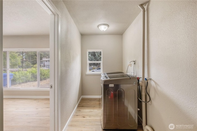 1513 154th St E, Tacoma, WA 98445 - laundry area featuring washer / dryer, a textured wall, wood finished floors, and a textured ceiling