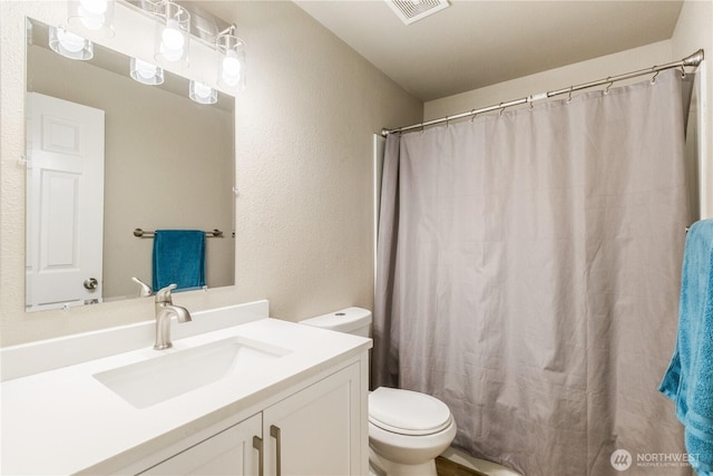 1513 154th St E, Tacoma, WA 98445 - bathroom with vanity, a textured wall, and curtained shower