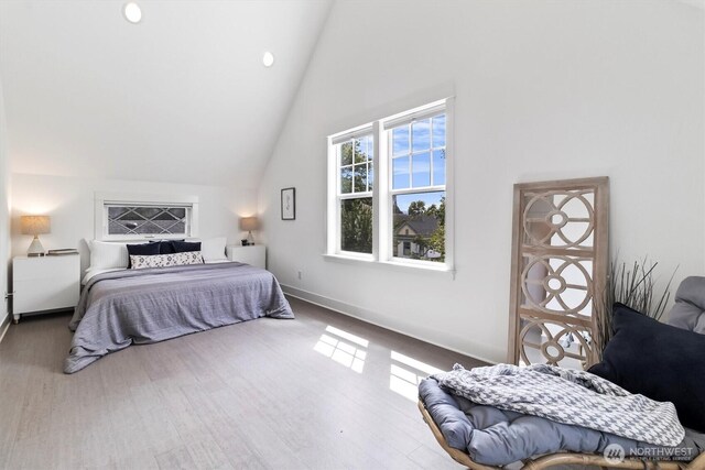 1615 Monroe St, Bellingham, WA 98225 - bedroom with high vaulted ceiling, wood finished floors, and recessed lighting