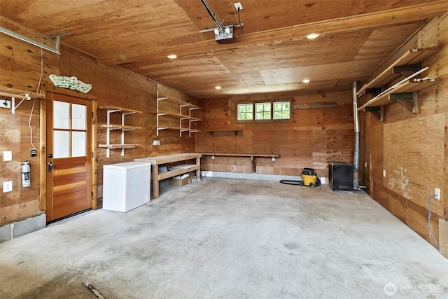 1615 Monroe St, Bellingham, WA 98225 - garage featuring wood walls, wood ceiling, recessed lighting, and a workshop area