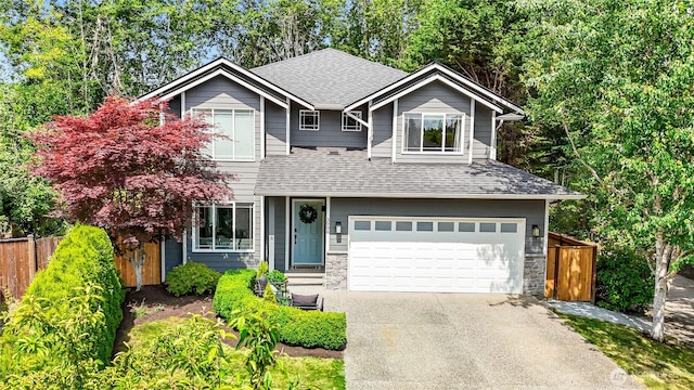 3906 141st Pl SE, Mill Creek, WA 98012 - view of front of property featuring roof with shingles, driveway, an attached garage, and stone siding
