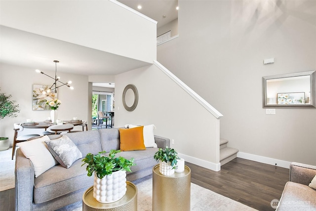 3906 141st Pl SE, Mill Creek, WA 98012 - living area featuring stairway, wood finished floors, a chandelier, a towering ceiling, and recessed lighting