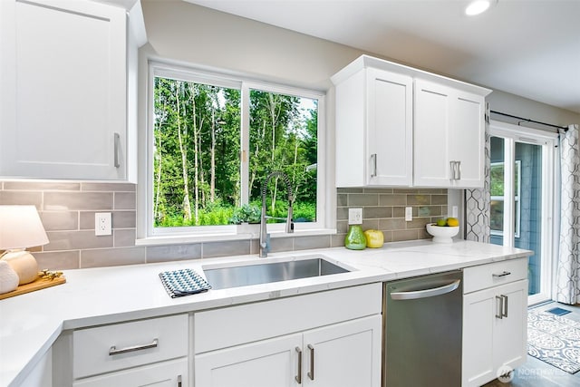3906 141st Pl SE, Mill Creek, WA 98012 - kitchen with dishwasher, white cabinets, decorative backsplash, recessed lighting, and light stone counters