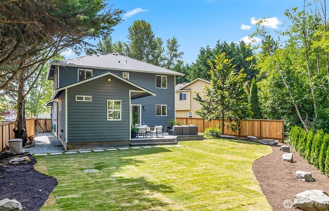 3906 141st Pl SE, Mill Creek, WA 98012 - rear view of property with an outdoor hangout area, a fenced backyard, and a patio