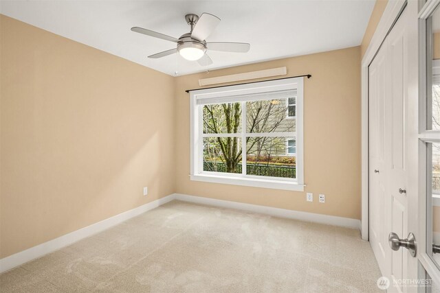1957 23rd Pl NE Unit 201, Issaquah, WA 98029 - spare room with light carpet and ceiling fan