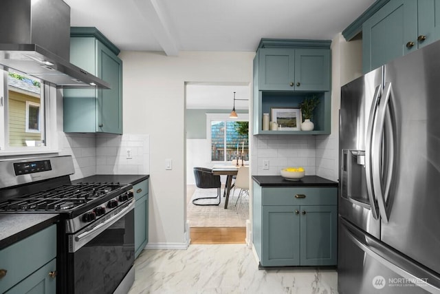 4055 SW Prince St, Seattle, WA 98116 - kitchen with stainless steel appliances, wall chimney range hood, dark countertops, and light marble finish flooring