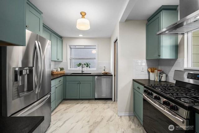 4055 SW Prince St, Seattle, WA 98116 - kitchen featuring stainless steel appliances, green cabinets, range hood, and dark countertops