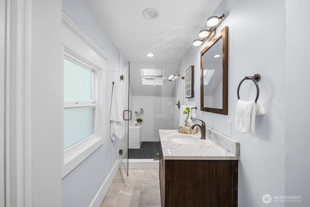4055 SW Prince St, Seattle, WA 98116 - full bathroom featuring vanity, marble look tile flooring, a stall shower, and recessed lighting