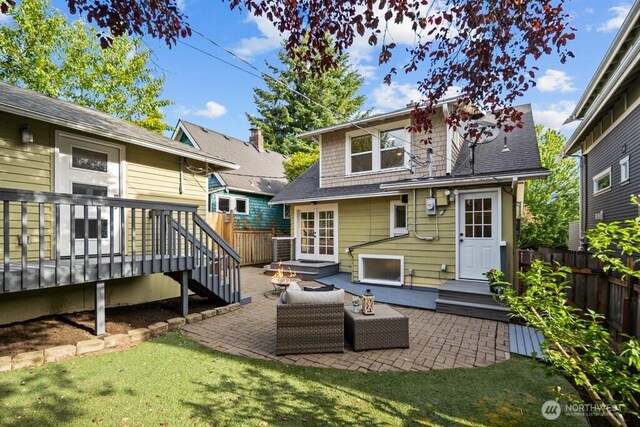 4055 SW Prince St, Seattle, WA 98116 - rear view of property featuring a wooden deck and a patio