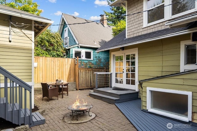 4055 SW Prince St, Seattle, WA 98116 - view of patio / terrace with an outdoor fire pit, french doors, and a deck