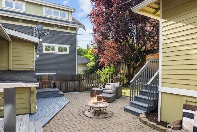 4055 SW Prince St, Seattle, WA 98116 - fenced backyard with a patio area and an outdoor living space with a fire pit