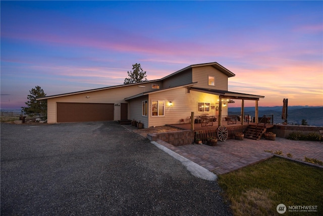 95 Horizon Ln, Chelan, WA 98816 - view of front of house featuring a garage, driveway, and a patio area