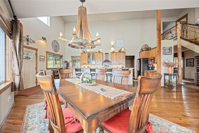 95 Horizon Ln, Chelan, WA 98816 - dining space with a high ceiling, a chandelier, and hardwood / wood-style flooring