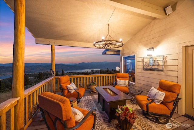 95 Horizon Ln, Chelan, WA 98816 - deck at dusk with an outdoor fire pit and a mountain view