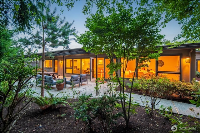 2325 38th Ave E, Seattle, WA 98112 - rear view of house featuring an outdoor hangout area and a patio area